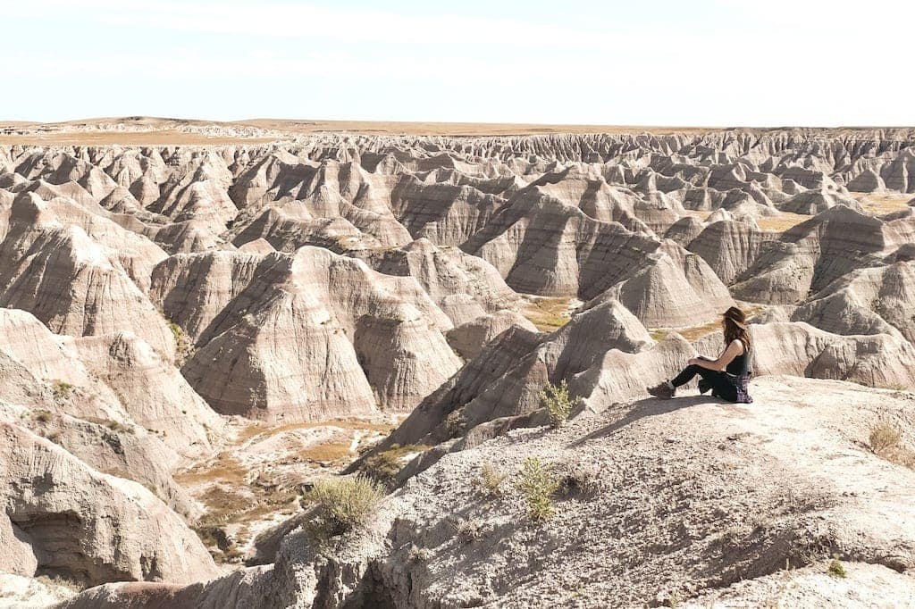 Woman sitting at Big Badlands Overlook