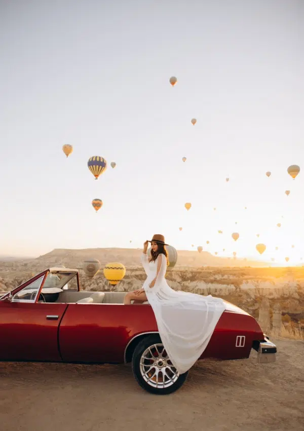 Woman surrounded by hot air balloons